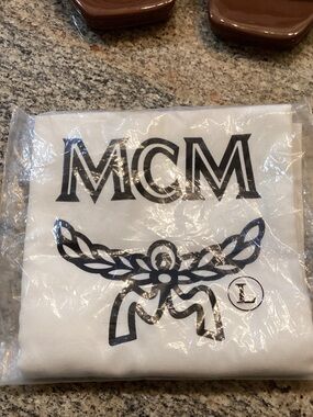 MCM White Dust Bag with Black Logo and Decorative Motif